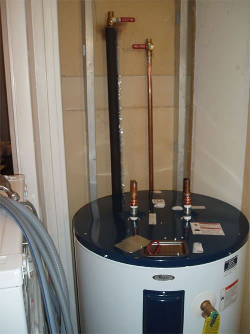 A water heater system (tank style) installed in a Greater Gainesville home